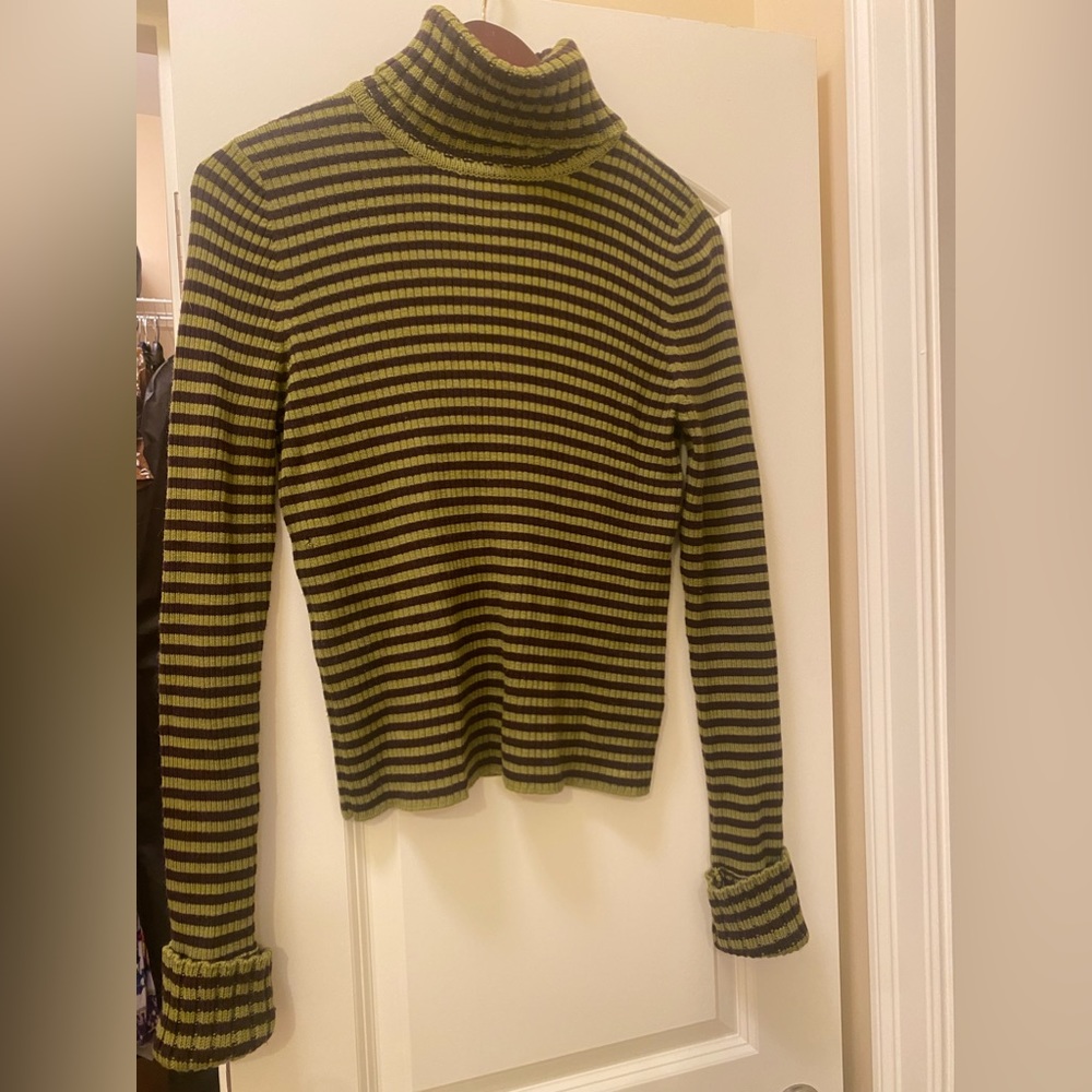 Turtle neck made from wool, not scratchy, very nice to the skin.Wore once